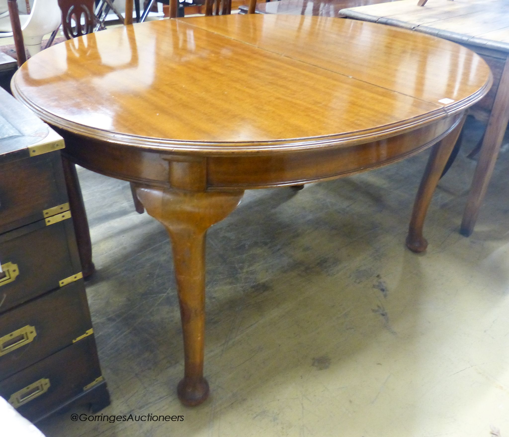A 1920's mahogany extending dining table, length 141cm, depth 110cm, height 76cm